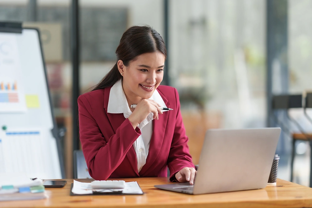 cheerful-asian-businesswoman-work-diligently-